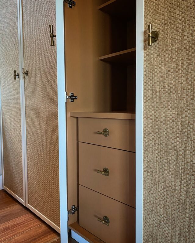 Wardrobe and home study in one. Grasspaper inserts and bronze handles on the doors with a funky internal colour make this an inviting room to walk into. Our Customised cable port in bronze completes it. Carefully designed by @studiogorman and building works by @thebuildingestablishment